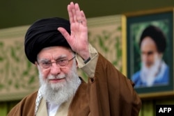 Supreme Leader Ali Khamenei greets attendees during a meeting with officials and ambassadors of Muslim nations in Tehran on January 28.