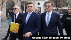 George Simion (center) prepares to file his application for candidacy in Romania's May presidential election in Bucharest on March 14.