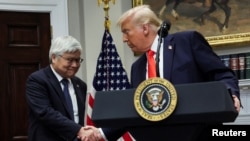 US President Donald Trump shakes hands with C.C. Wei, Chairman and CEO of TSMC, after annoucing a $100 billion investment on March 3.