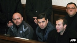 Former Defense Minister Irakli Okruashvili (center) sits in a Tbilisi court in December 2012.