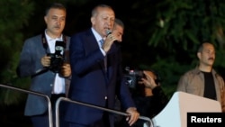 Turkish President Recep Tayyip Erdogan addresses supporters on June 24.