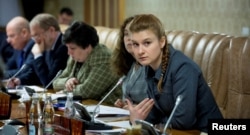 Butina (right) gained a name for herself in Russia in 2012 as she sought to build a Russian equivalent of the National Rifle Association.