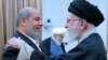 Iranian Supreme Leader Ayatollah Ali Khamenei (right) greets Hama leader Khalil al-Hayya in Tehran on February 8. 