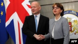 Georgian Foreign Minister Maia Panjikidze (right) with her British counterpart William Hague in Tbilisi on May 8. 